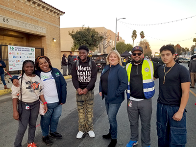 Watts YouthSource Youth Council members work with staffers from Council District 15 to make their December 2023 Winter Wonderland event a success for local families