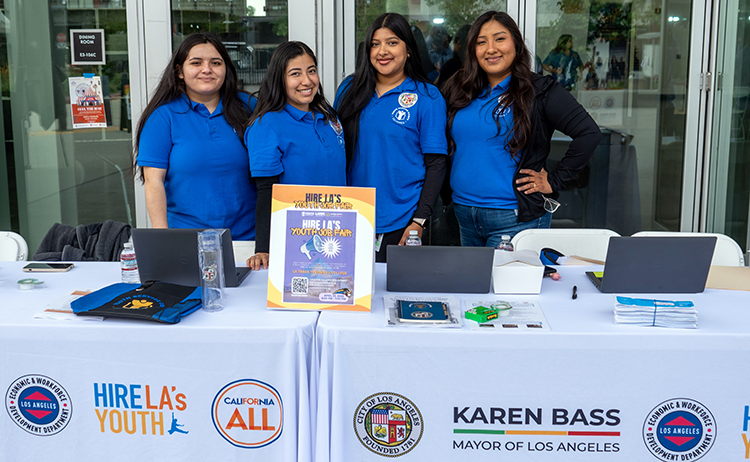 The Hire LA's Youth team at an information table during a Hire LA Day event for young Angelenos