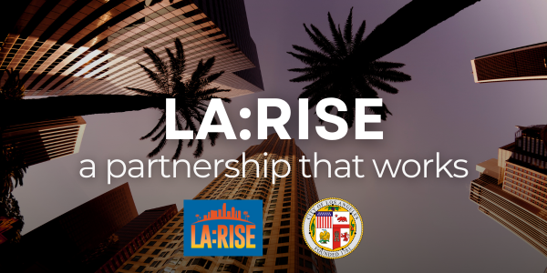 LA:RISE, a partnership that works: text overlaid on an image of the Downtown Los Angeles financial district looking up towards the sky between skyscrapers