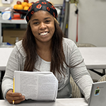 Ebony Mckinney, LA:RISE Youth Academy participant, studying between her Central City Neighborhood Partners intern shifts