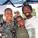 Wo'se Kofi, far right, owner of Baba's Vegan Cafe in South L.A.